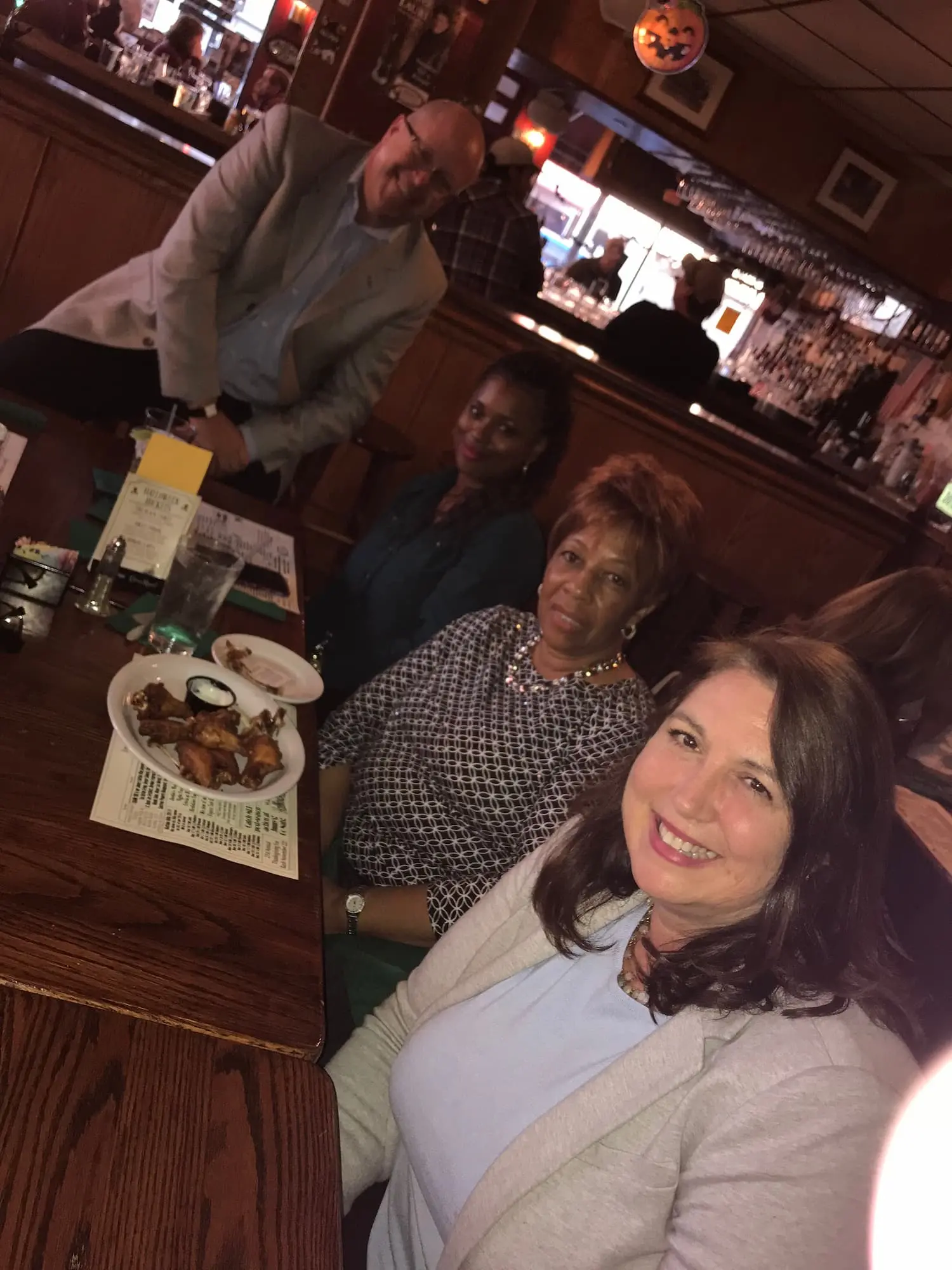 members at table smiling