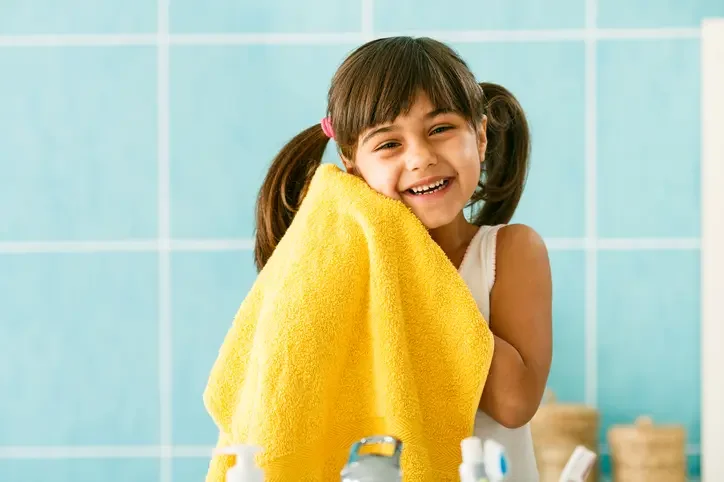 Girl with washcloth