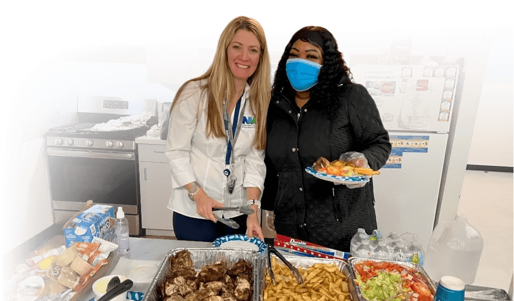 TaraLynn with NWFCU Foundation serving up food for a food donation program