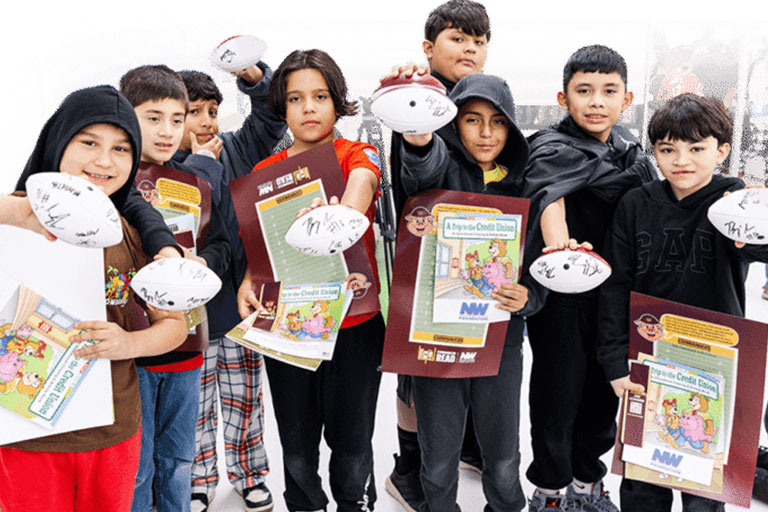 Students participating in an educational field trip activity outdoors.